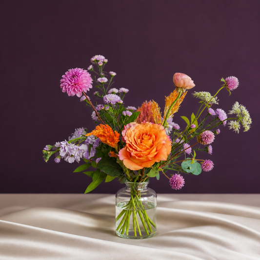 small flower arrangement in a jar