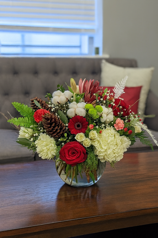 Holiday arrangement on a wood table