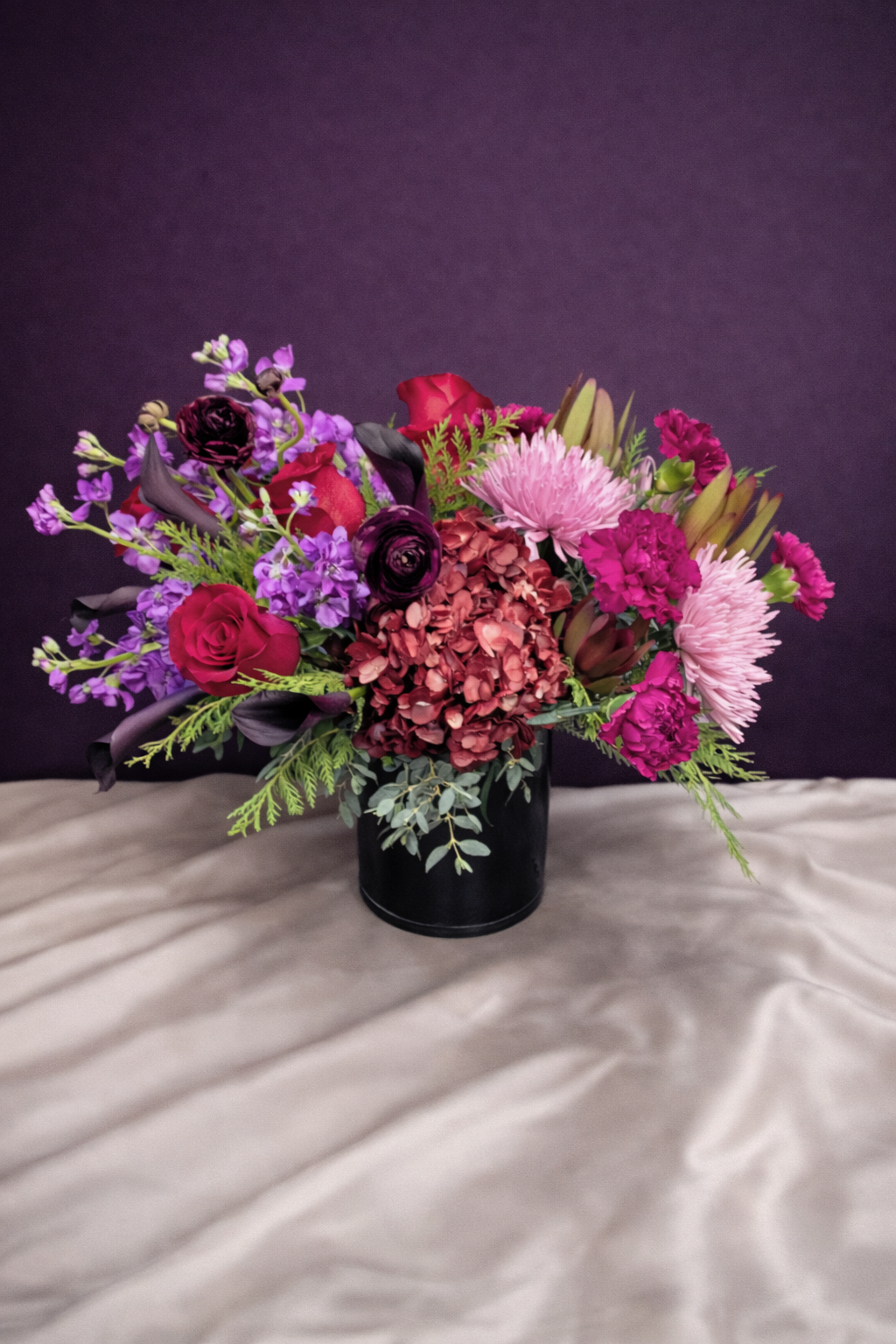 bold moody flowers on a white cloth