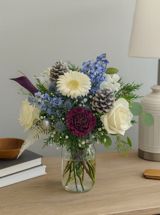 jar of flowers on desk